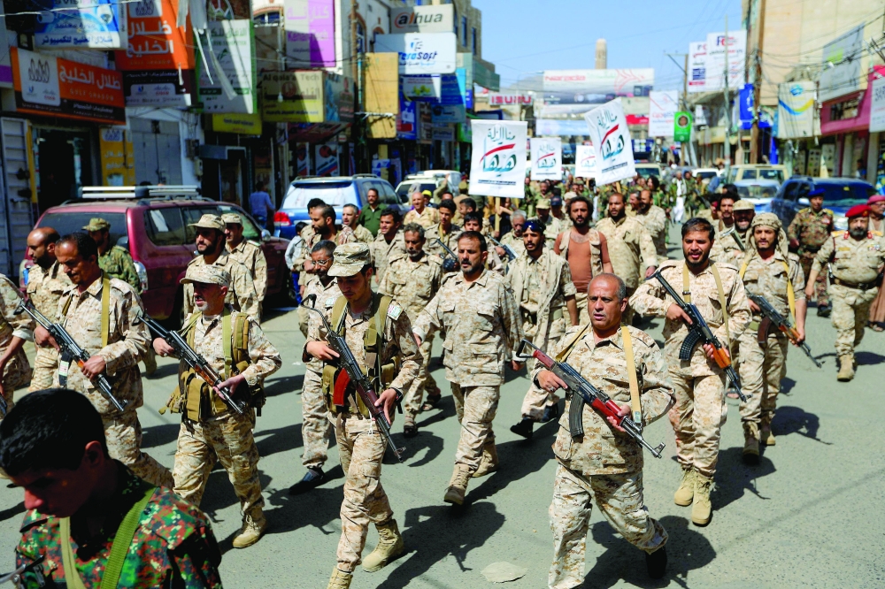 Forces loyal to Yemen's Ansar Alla fighters take part in a military parade marking the seventh anniversary of the coalition's intervention in their country, in Sanaa. - AFP