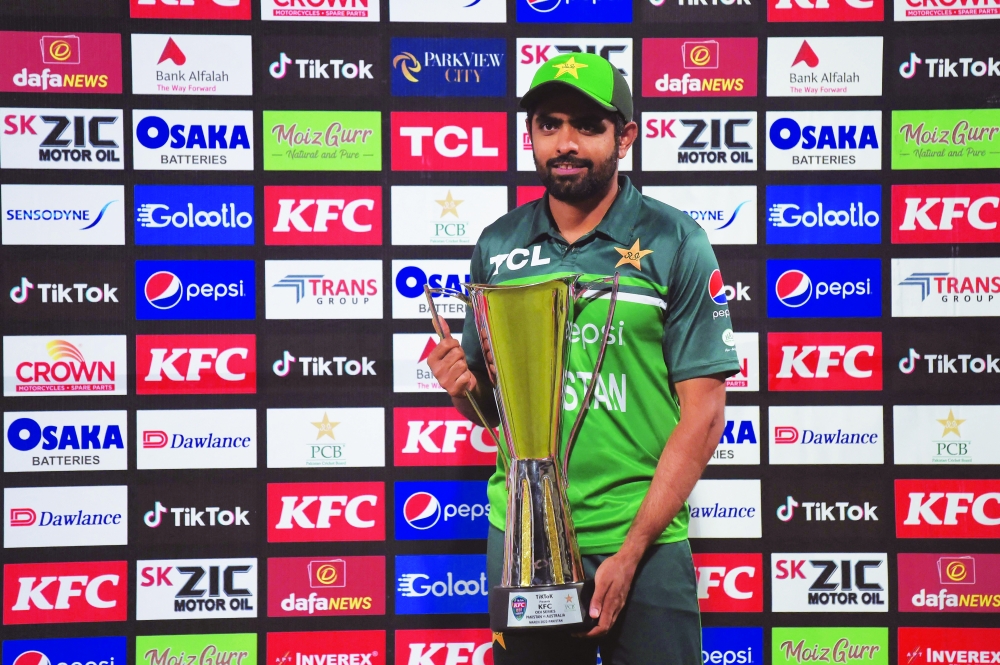 Pakistan's captain Babar Azam poses with the trophy after winning the ODI series against Australia at the Gaddafi Cricket Stadium in Lahore. -- AFP