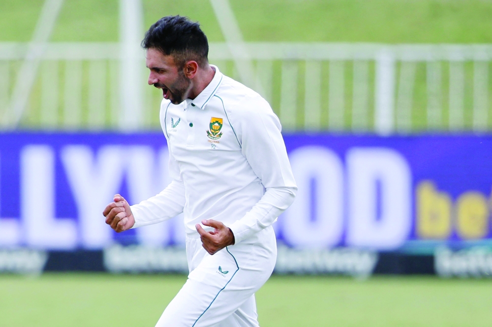 South Africa's Keshav Maharaj celebrates after the dismissal of Bangladesh's Mushfiqur Rahim (not seen) during the fifth day of the first Test. -- AFP