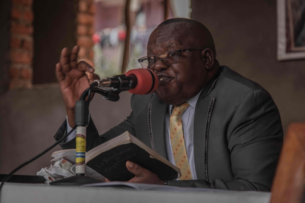 Chirhuza Zagabe, 60, pastor of the Primitive Church of the Lord, preaches during the dominical service in Bukavu, eastern Democratic Republic of Congo, on March 20, 2022.