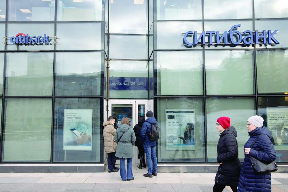Customers wait to enter a branch of Citibank AO in Moscow, Russia, in this file photo. — AFP
