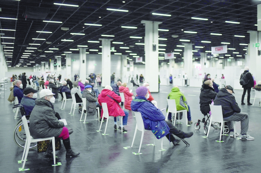 In this file photo taken on February 8, 2021 elderly people wait at the Covid-19 vaccination centre for their vaccination in Cologne, western Germany. - AFP