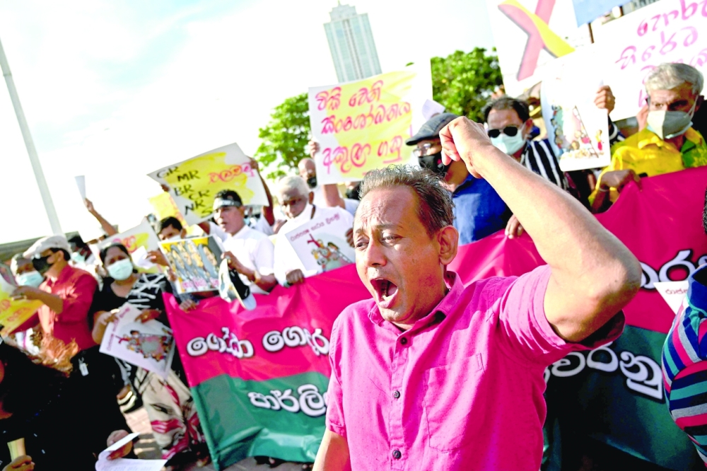 Sri Lankan activists take part in a demonstration outside the US Embassy in Colombo on Thursday, denouncing the government of President Gotabaya Rajapaksa who renounced his US citizenship in 2019 to contest elections. - AFP