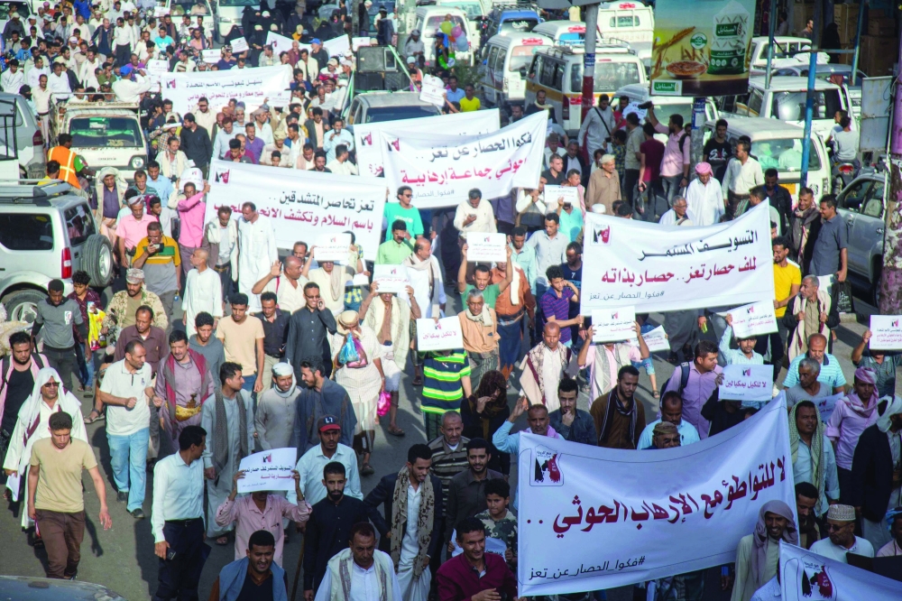 Demonstrators protest against the armistice and call for the lift of the siege on Taez governorate, on Wednesday in Yemen's third city of Taez. - AFP 
