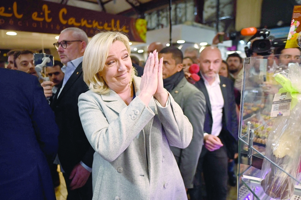 French far-right presidential candidate Marine Le Pen said she had never been 'so close' to power at a jubilant final rally before the election. -- AFP 