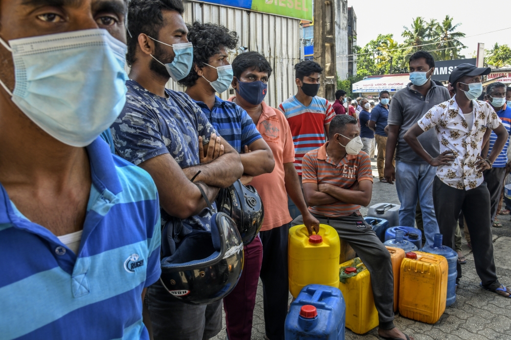 People wait in a line for diesel in Colombo, Sri Lanka on March 11, 2022. (Atul Loke/The New York Times)