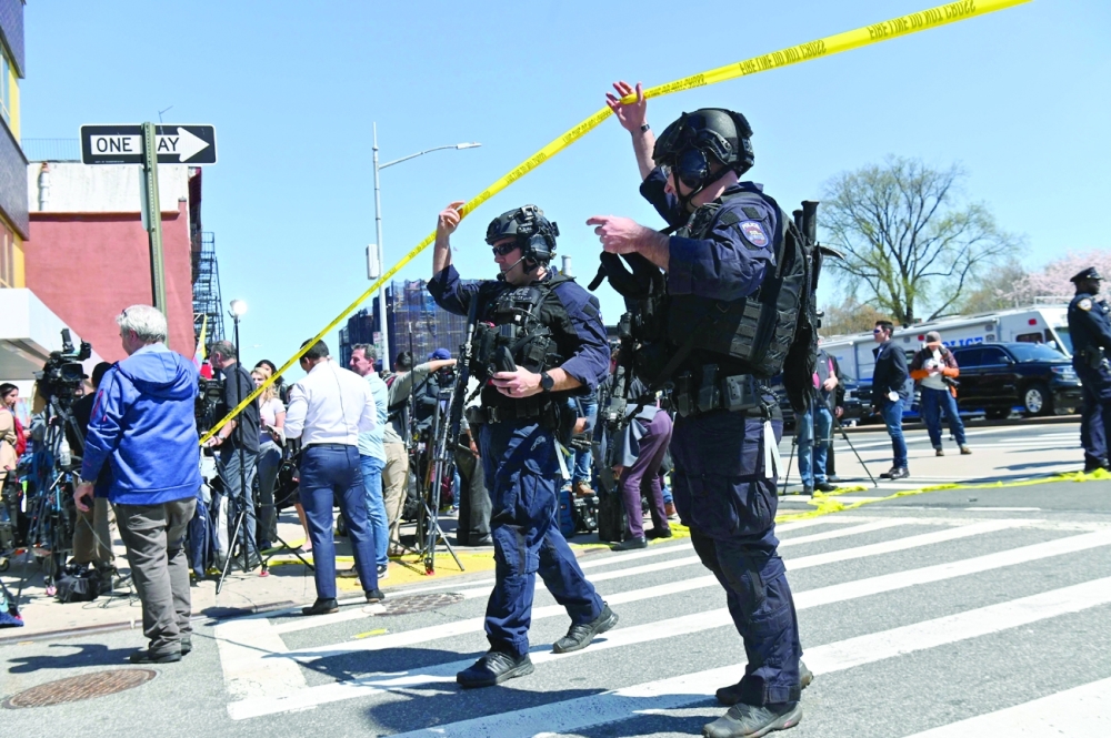 Emergency personnel cross near a subway station in New York City. - AFP