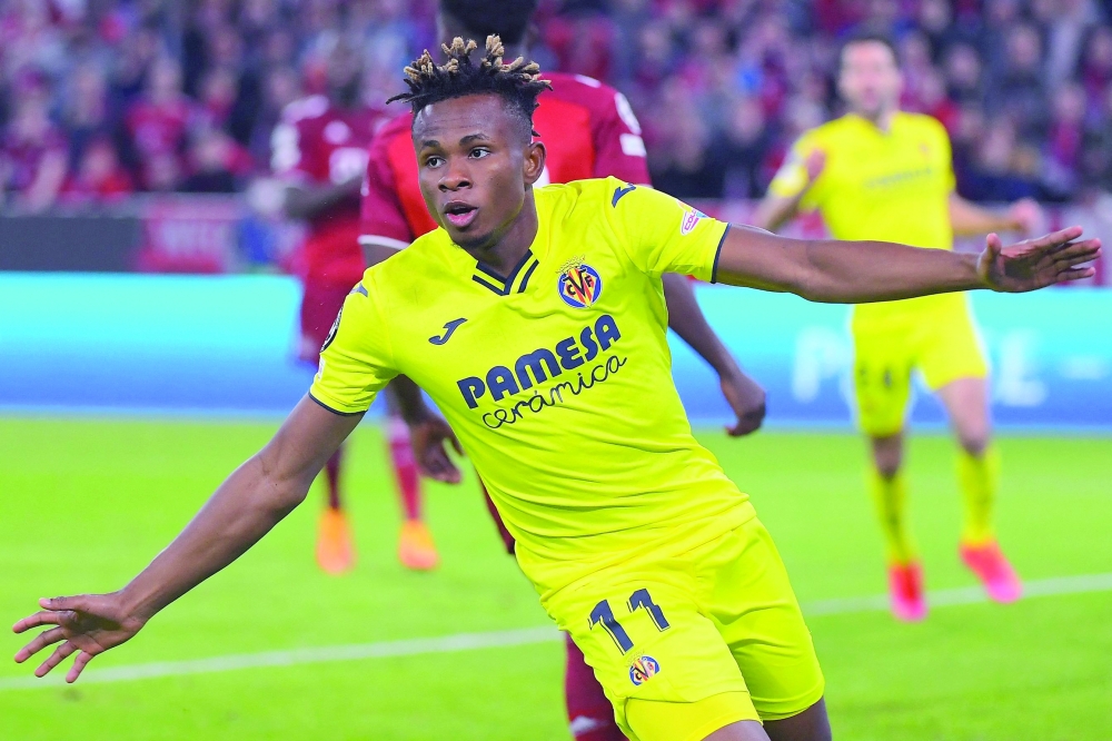 Villarreal's Nigerian midfielder Samuel Chukwueze celebrates scoring the 1-1 during the UEFA Champions League quarter-final, second leg football match FC Bayern Munich v FC Villarreal in Munich, southern Germany on April 12, 2022.  (Photo by Jose Jordan / AFP)

