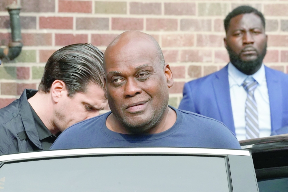 Frank R James is led away into Federal Custody in New York City. - AFP