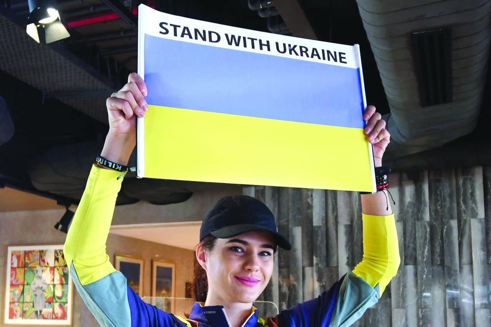 Ukraine's mountaineer Antonina Samoilova poses with Ukraine's national flag in Kathmandu. - AFP 