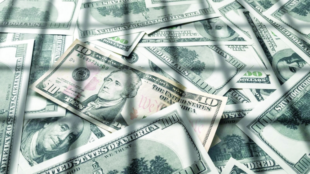 Shadow from the lattice on dollar bills. The concept of prison, the penalty for money laundering, theft, crime and the penalty for tax evasion. Corruption and counterfeiting.