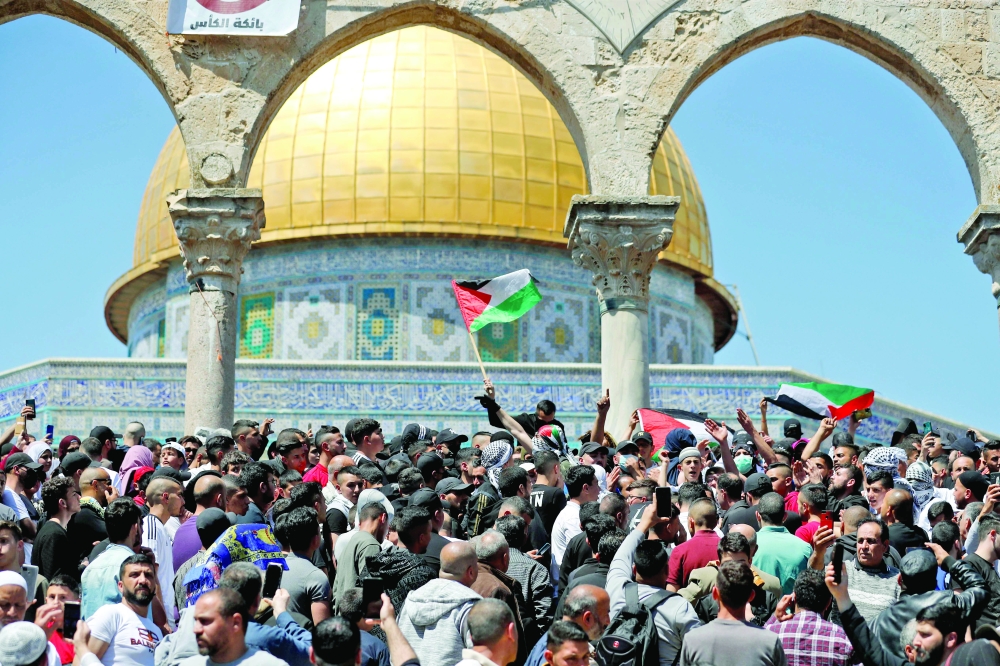 Muslim worshippers gather for Friday prayers at Al Aqsa Mosque complex on Friday. - AFP 

