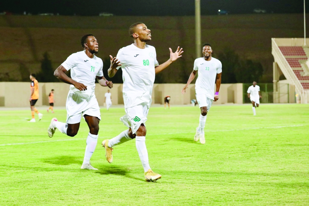 Al Oruba players celebrate a goal.