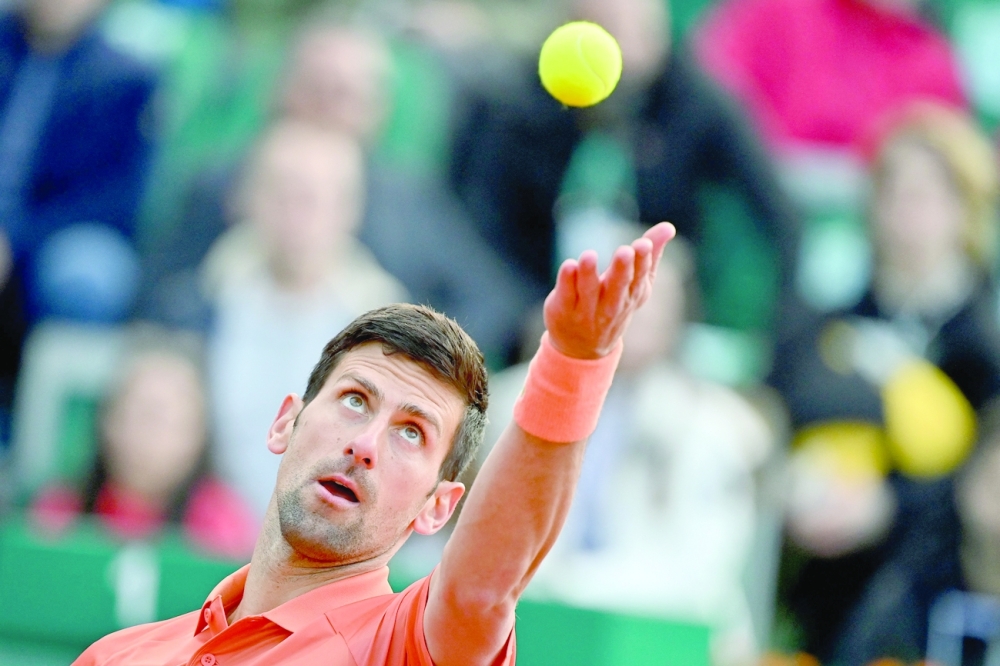 TOPSHOT - Serbia's Novak Djokovic serves the ball to Serbia's Laslo Djere during their tennis single match at Serbia Tennis Open ATP 250 series tournament in Belgrade on April 20, 2022.  (Photo by ANDREJ ISAKOVIC / AFP)

