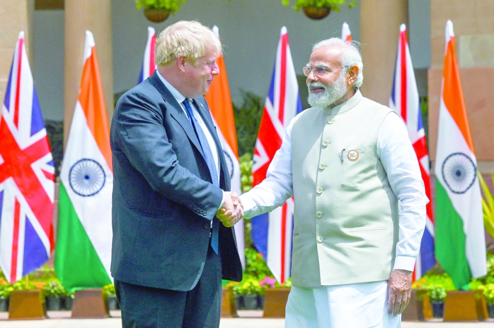 India's Prime Minister Narendra Modi with his British counterpart Boris Johnson before a meeting at Hyderabad House in New Delhi on Friday. - AFP