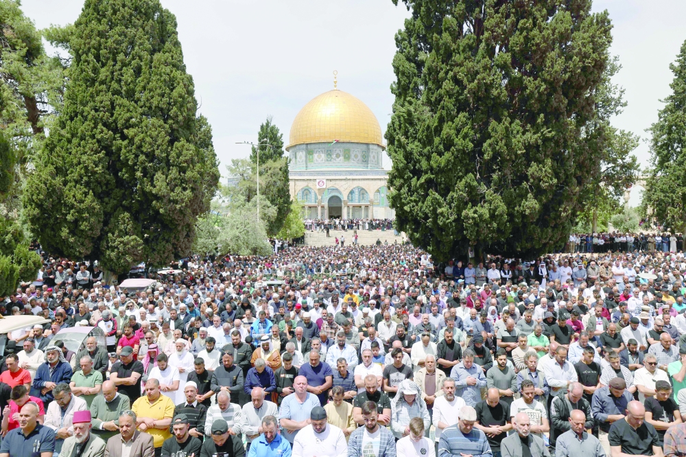 Palestinians perform Friday prayers, the third of Ramadhan, at Jerusalem's Al Aqsa mosque complex.  - AFP