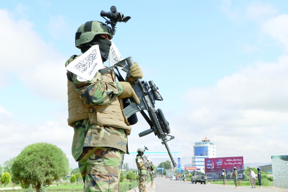 A member of the Taliban stands guard in Herat. - AFP file photo