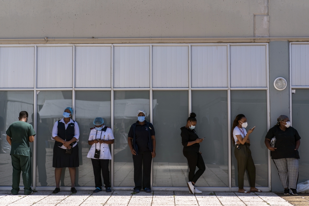  Health workers line up for their COVID-19 vaccinations in Johannesburg, South Africa, on March 5, 2021. (Joao Silva/The New York Times)