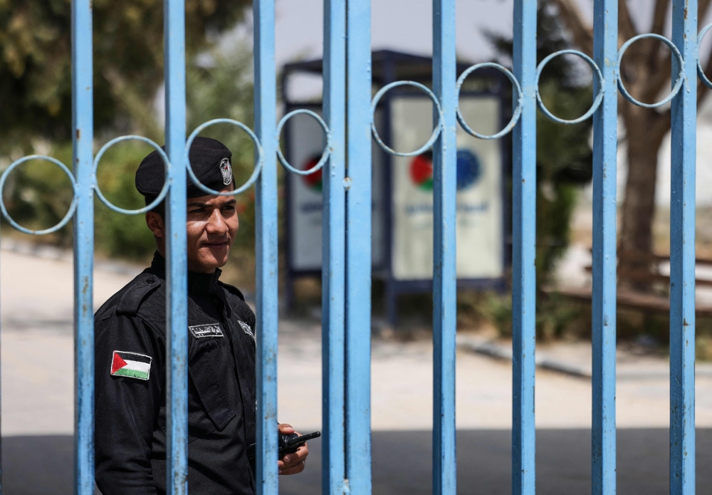 A police officer stands guard at the Palestinian Authority side of the Erez Crossing in Beit Hanoun in the northern Gaza Strip. -  AFP