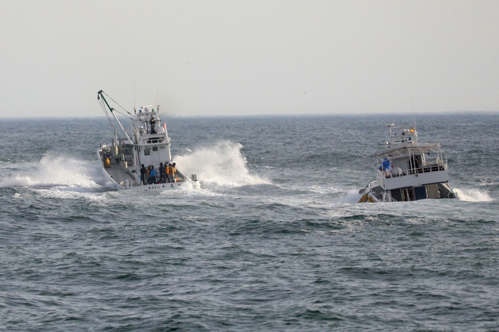 Fishing boats conduct a search operation for missing people aboard the 'Kazu 1' sightseeing boat, in the Sea of Okhotsk near Shari, Okhotsk Subprefecture of Hokkaido. - AFP