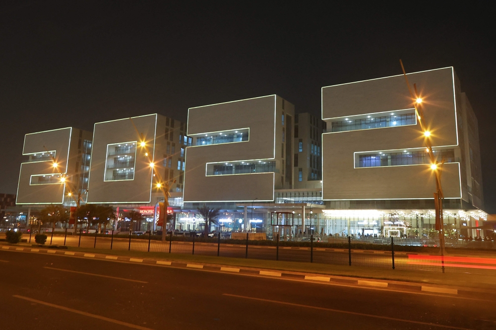 This picture taken on April 25, 2022 shows a building complex in the shape of the year 2022 at Doha Sports City near Khalifa International Stadium in Qatar's capital Doha.  (Photo by KARIM JAAFAR / AFP)