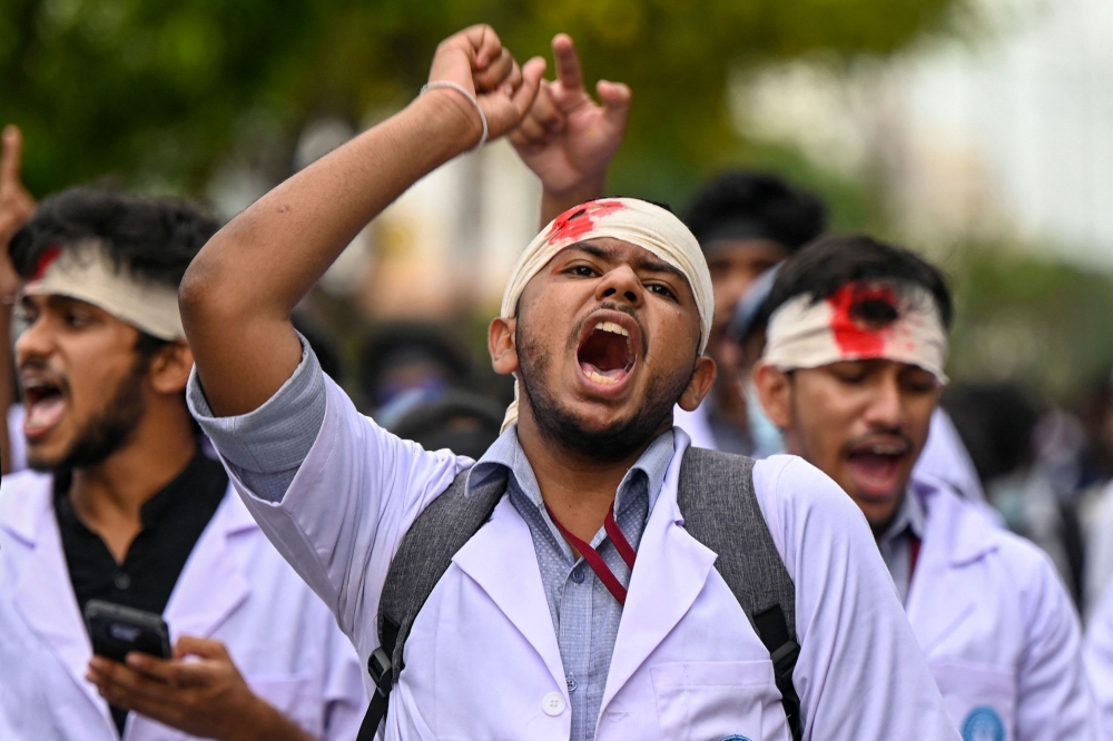 Students from the faculty of medicine and sciences take part in an anti-government demonstration in Colombo. - AFP