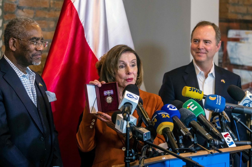 US Speaker of the House Nancy Pelosi presents the Order of Princess Olga, she was awarded with by the Ukrainian President during a press conference in Rzeszow, southeastern Poland. — AFP