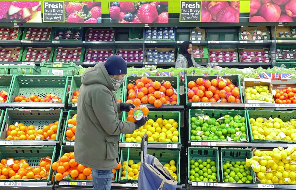 A man shops for food items inside a supermarket store in London. — AFP 