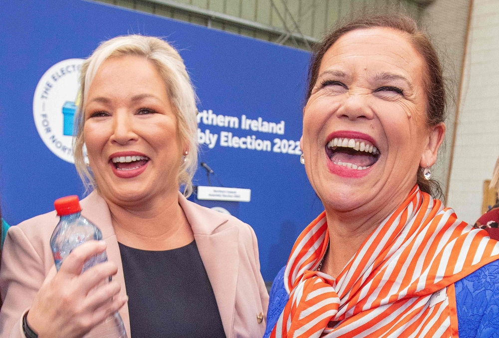 Deputy First Minister of Northern Ireland, Michelle O'Neill reacts with party Leader Mary Lou McDonald, after the count at the Magherafelt Meadowbank sports centre in Londonderry. - AFP