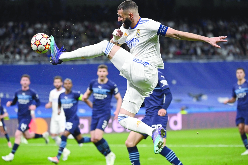 Real Madrid's French forward Karim Benzema controls the ball during the Uefa Champions League semifinal second leg football match between Real Madrid CF and Manchester City at the Santiago Bernabeu Stadium in Madrid. — AFP