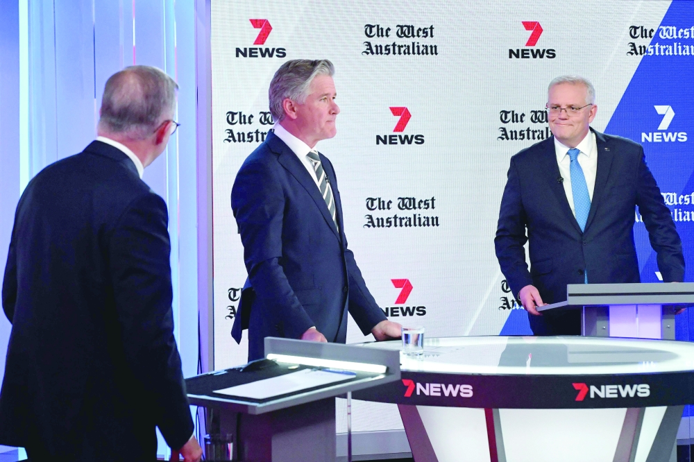 Australian Prime Minister Scott Morrison and Opposition Leader, Anthony Albanese, attend the third leaders' debate of the 2022 federal election campaign in Sydney. - AFP 
