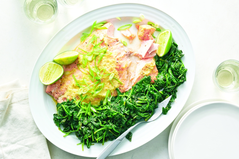 Roasted wild salmon with ginger-lime butter in New York, April 25, 2022. Food styled by Simon Andrews. (David Malosh/The New York Times)