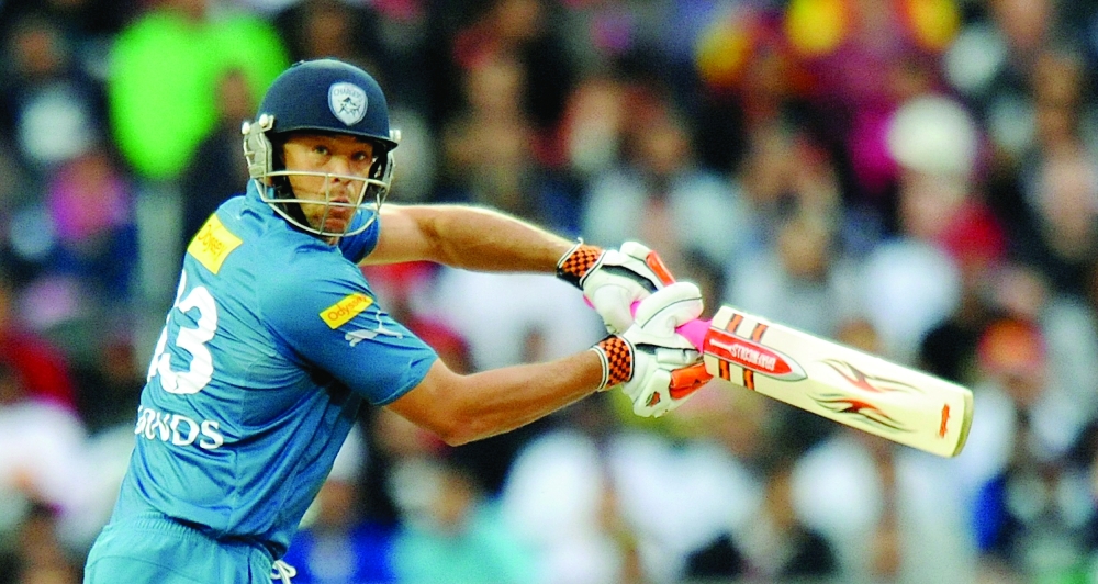 (FILES) In this file photo Australian cricketer Andrew Symonds of Deccan Chargers watches the ball after playing a delivery from South African bowler Roelof van der Merwe of Royal Challengers Bangalore during their IPL Twenty20 final match at The Wanderers Stadium in Johannesburg on May 24, 2009.    Former all-rounder Andrew Symonds has died in a car crash, multiple local media reports said May 15, 2022, in another tragic blow for Australian cricket. (Photo by Alexander JOE / AFP)

