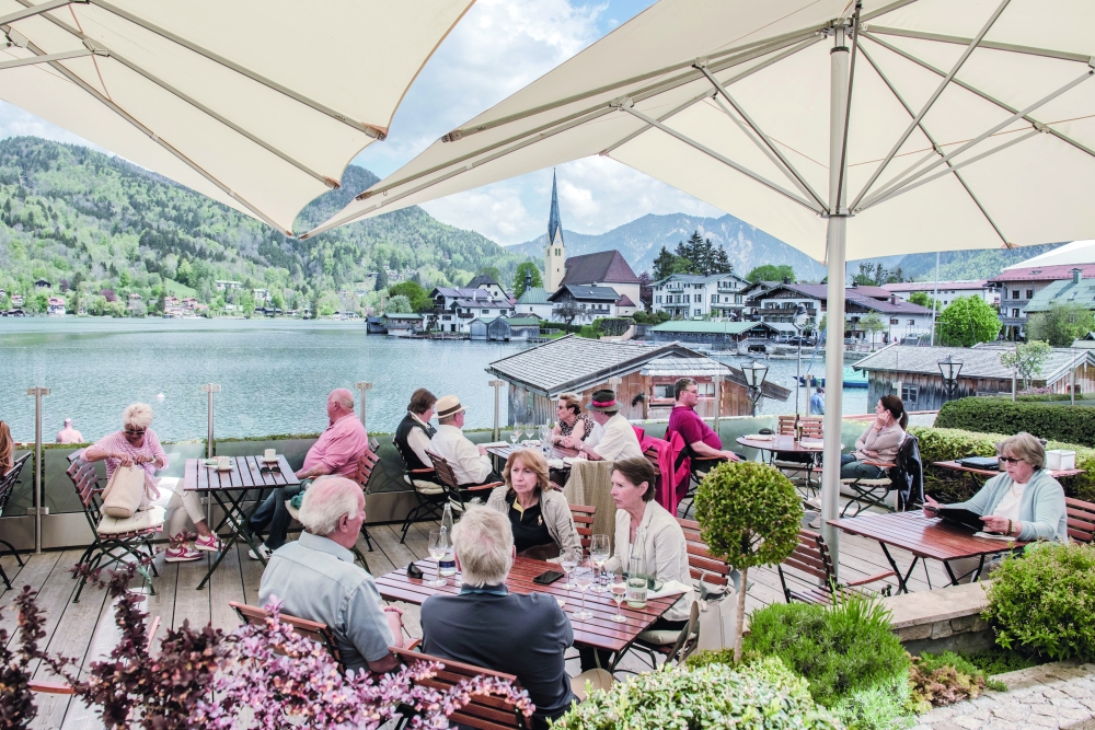 Diners at a luxury hotel next to Tegernsee Lake, in Rottach-egern, Germany.
