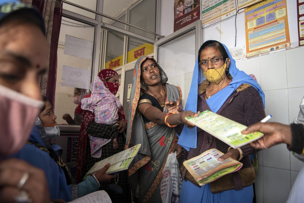 Women await care at a community health center in Bonli, India, on Feb. 10, 2022.  (Saumya Khandelwal/The New York Times)