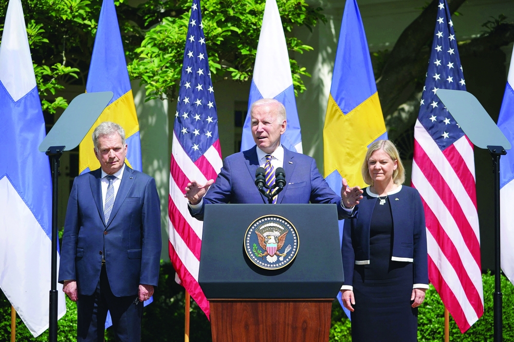 US President Joe Biden, flanked by Sweden’s Prime Minister Magdalena Andersson and Finland’s President Sauli Niinistِ, speaks in the Rose Garden following a meeting at the White House in Washington, DC, on Thursday. - AFP