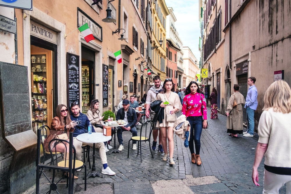 Cafes along Via delle Muratte, near Trevi Fountain, in Rome, May 7, 2022. (Francesco Lastrucci/The New York Times)