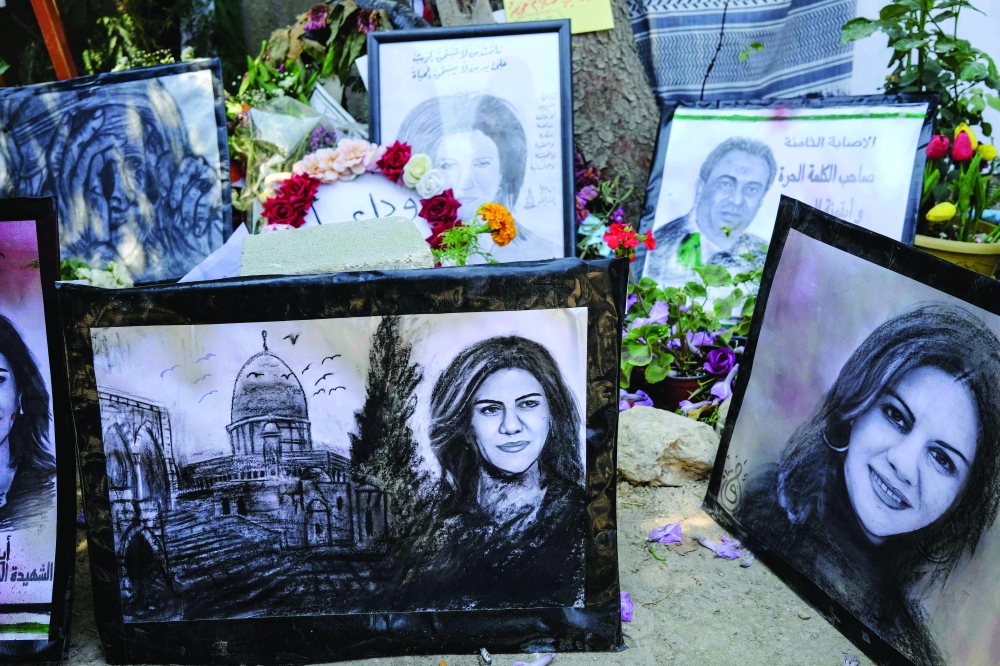 Portraits of late Palestinian Al Jazeera journalist Shireen Abu Akleh are seen at an art exhibit honouring her in Jenin city in the occupied West Bank, on Thursday. - AFP