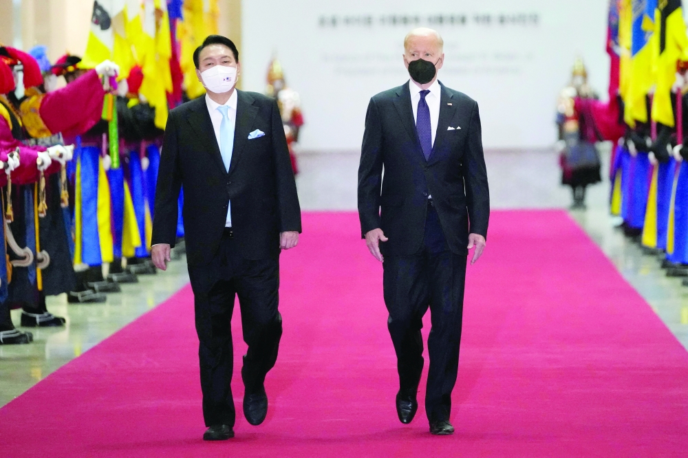 South Korean President Yoon Suk-yeol and US President Joe Biden arrive for a state dinner at the National Museum of Korea in Seoul. - AFP

