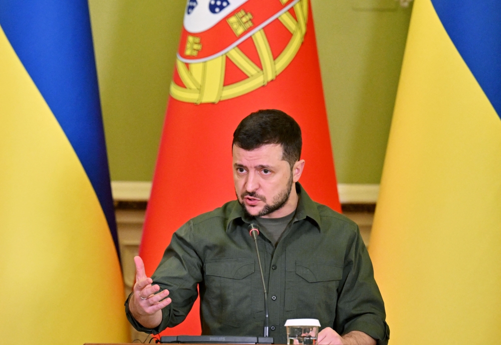 Ukrainian President Volodymyr Zelensky delivers a speech during a press conference with Portugal's Prime Minister Antonio Costa (unseen) in Kyiv. - AFP