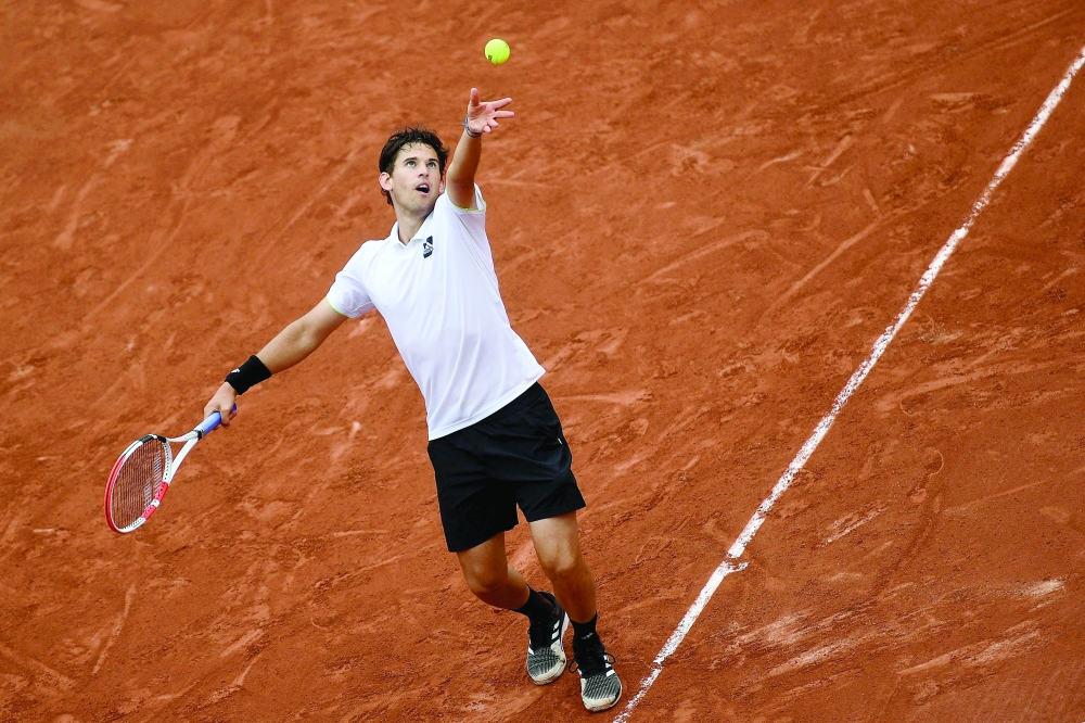 Austria's Dominic Thiem serves during his men's singles match against Bolivia's Hugo Dellien at the Court Simonne-Mathieu on day one of the Roland-Garros Open tennis tournament in Paris on May 22, 2022.  (Photo by Christophe ARCHAMBAULT / AFP)

