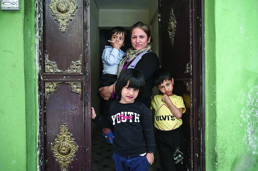 Fatima Ibrahim, who came from Kobane, poses with her children, in Sanliurfa. — AFP