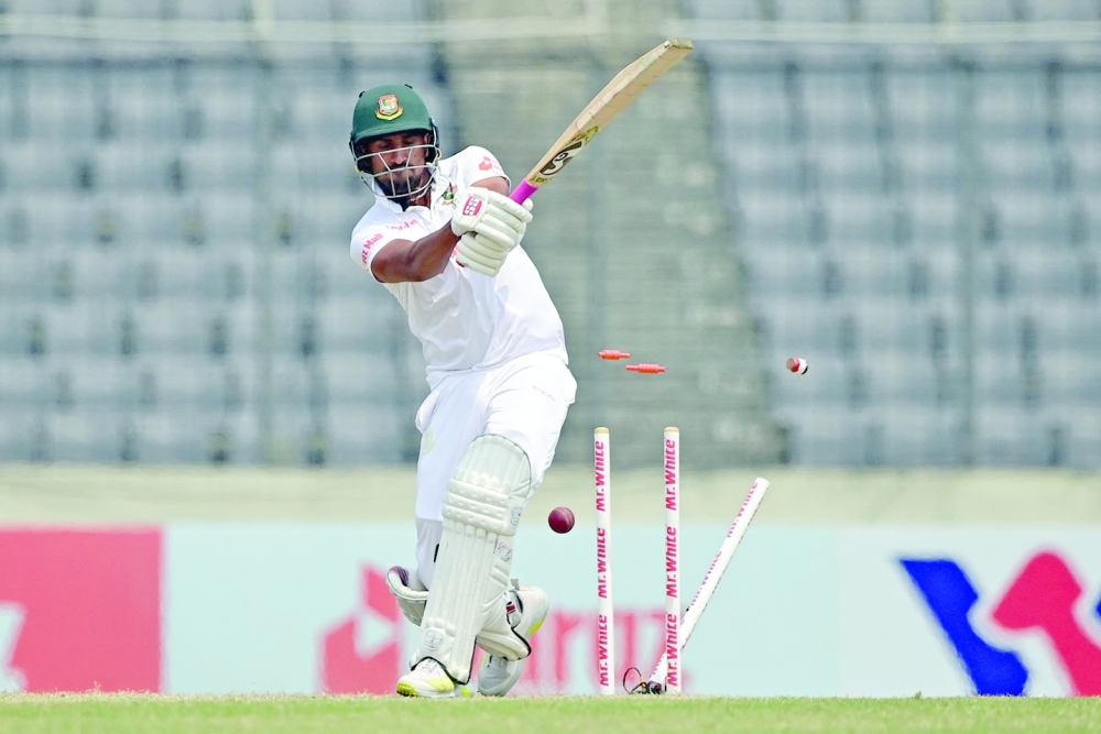Bangladesh's Khaled Ahmed is clean bowled by Sri Lanka's Asitha Fernando during the final day of the second Test in Dhaka. -- AFP

