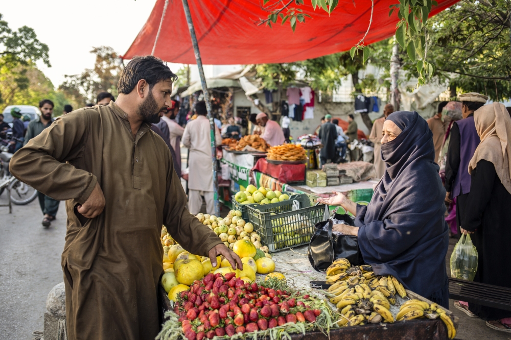 Local vendors sell vegetables in Abpara, one of the busiest markets in Islamabad, Pakistan on April 6, 2022. (Saiyna Bashir/The New York Times)