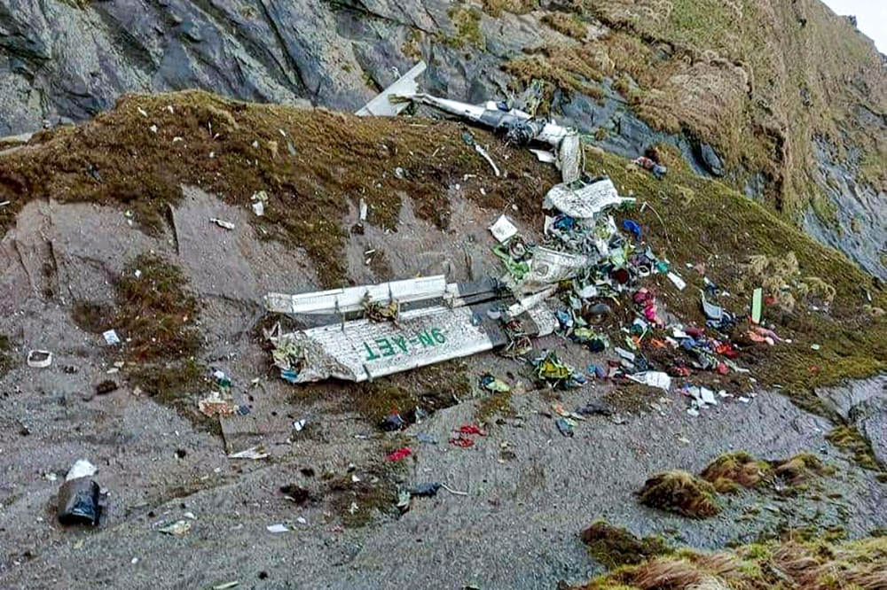 The wreckage of a Twin Otter aircraft, operated by Nepali carrier Tara Air, lay on a mountainside in Mustang on May 30, 2022, a day after it crashed.  