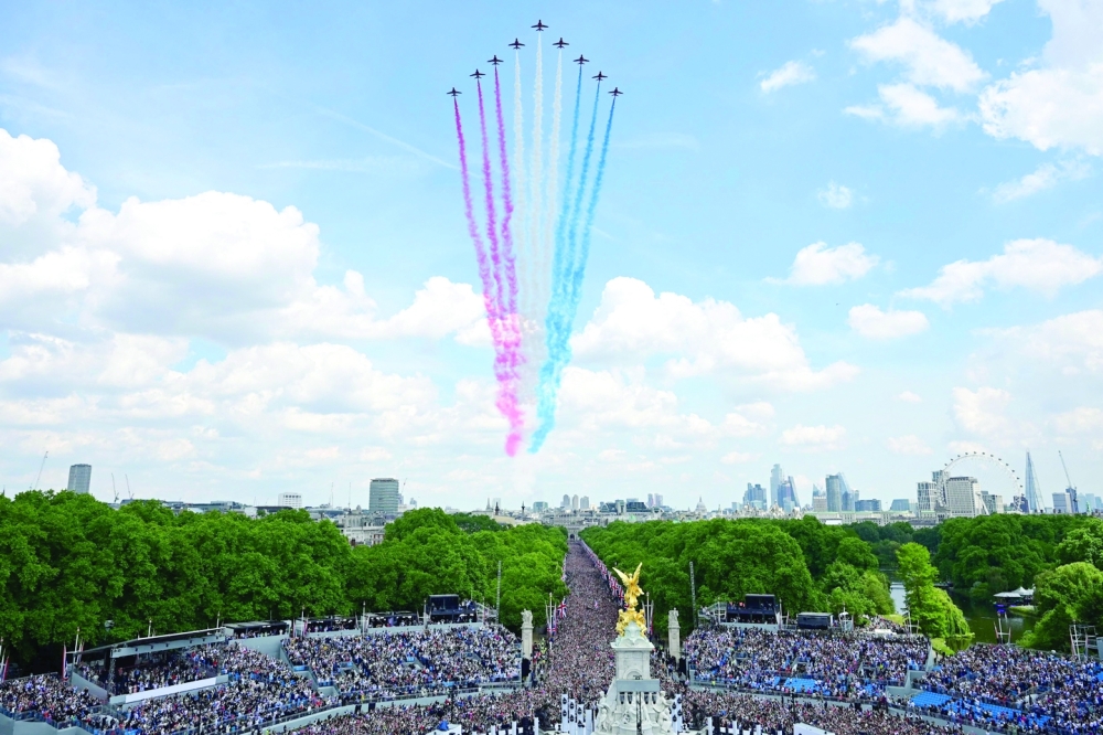 The Royal Air Force Aerobatic Team, the Red Arrows, fly in formation during a special flypast from Buckingham Palace balcony following the Queen's Birthday Parade, the Trooping the Colour, as part of Queen Elizabeth II's platinum jubilee celebrations, in London on Thursday. - AFP 