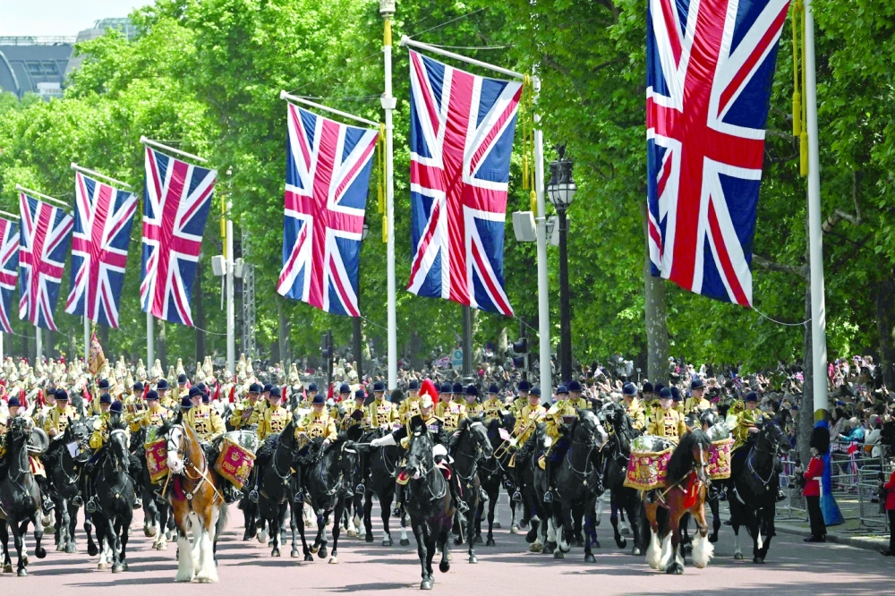 Members of Band of the Household Cavalry ride back along The Mall towards Buckingham Palace during the Queen's Birthday Parade. 