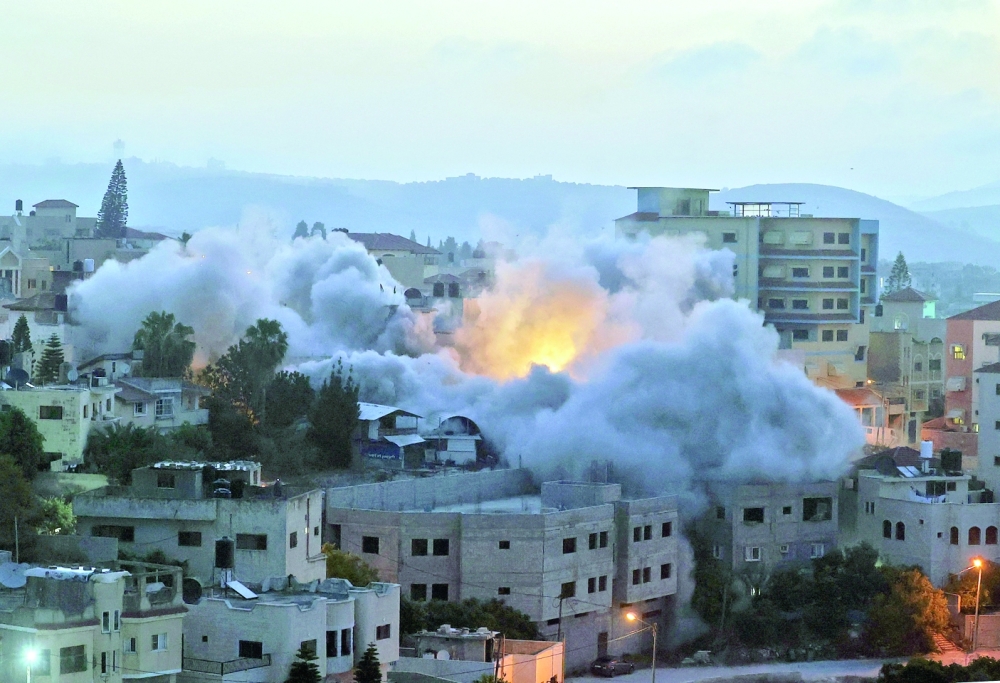 The Israeli army blows up the family house of Diaa Hamarsha, a Palestinian who in March allegedly killed five people in a gun attack in Bnei Brak near Tel Aviv, in the village of Yabad near the occupied West Bank town of Jenin, on Thursday. - AFP