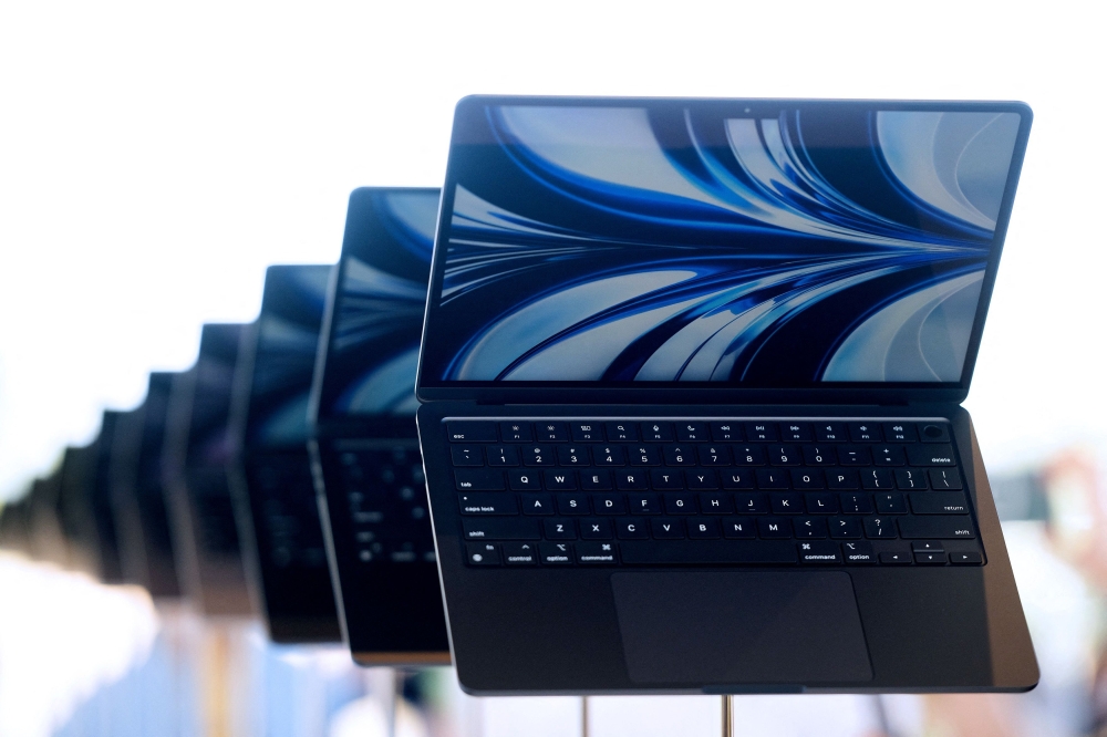 The new MacBook Airs are displayed inside the Steve Jobs Theater during the Apple Worldwide Developers Conference (WWDC) at the Apple Park campus in Cupertino, California on June 6, 2022 . 