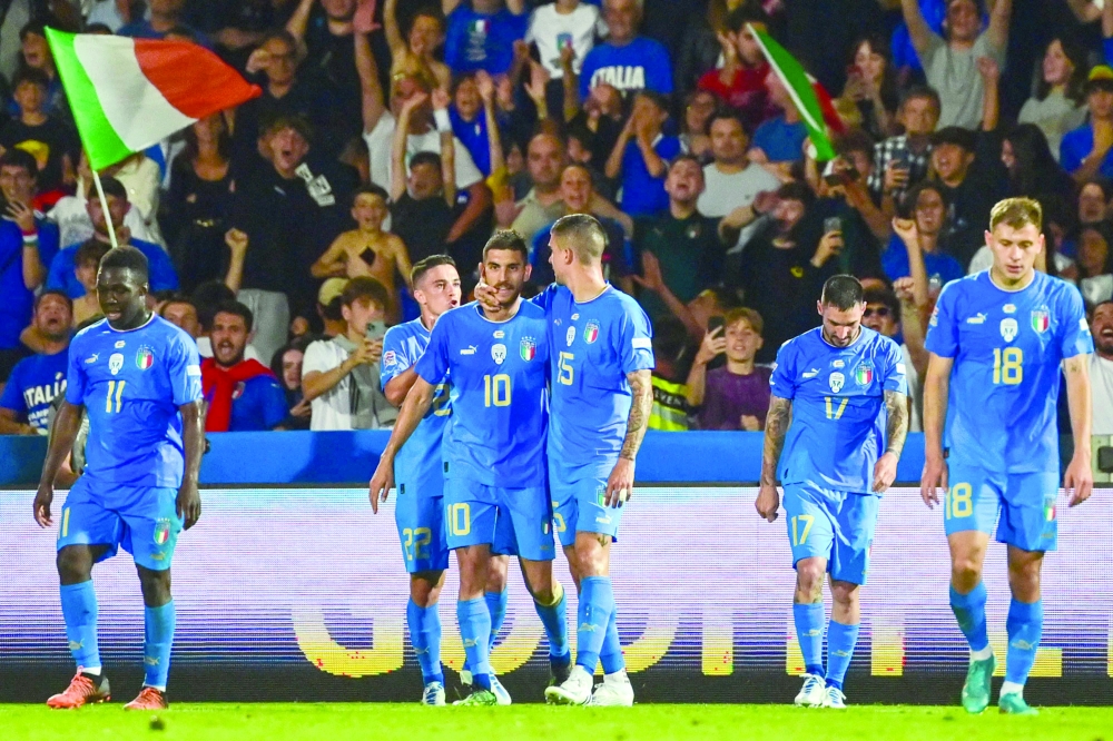 Italy's midfielder Lorenzo Pellegrini (3rdL) celebrates after scoring during the UEFA Nations League - League A, Group 3 first leg football match between Italy and Hungary on June 7, 2022 at the Dino-Manuzzi stadium in Cesena. (Photo by MIGUEL MEDINA / AFP)

